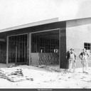 Jack and Forest Lamberton at West Side Fire House, roof installed. The two worked for contractor C.B. Bagnall to build the West Side Fire House. Santa Cruz, California c.1954.