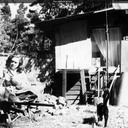 Norma outside the shack on Valley View Road, soon after buying and moving in. The house was modest, but the location was pleasant and safe for the cats. Oakland, California c.1954-55.