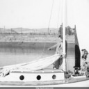 Norma and Jody Hand giving advice to Tom Hand aboard gaff-rig sailboat, prior to departing Port Chicago for Berkeley. Norma and Jody Hand giving advice to Tom Hand aboard gaff-rig sailboat, prior to departing Port Chicago for Berkeley.