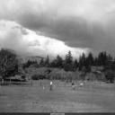 Nephews Stephen and Dana, brother David and wife Olive, and Norma playing baseball in pasture, Kenwood