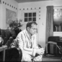 Jack in front of woodstove in Kenwood farmhouse